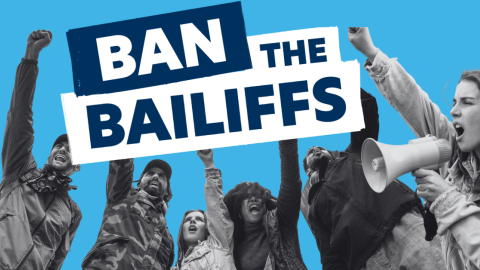 People protesting bailiff use. Text reads: Ban the Bailiffs